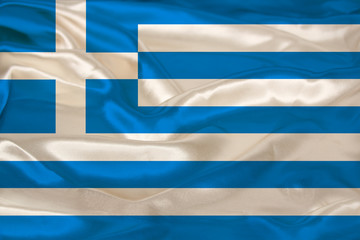 beautiful photo of the colored national flag of the modern state of Greece on textured fabric, concept of tourism, emigration, economics and politics, close up