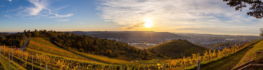 Autumn sunset view of Stuttgart sykline overlooking the colorful vineyards. The iconic Fernsehturm...