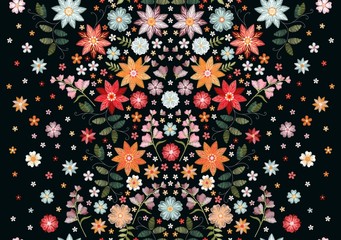 Symmetric seamless embroidery pattern with beautiful flowers and leaves on black background.