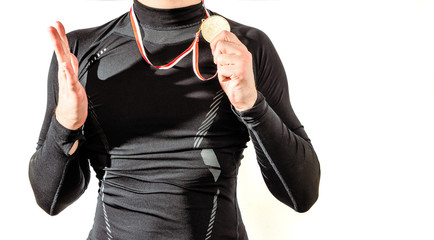 The athlete is happy with the gold medal, victory. Player Happy to win a gold medal. The concept of...