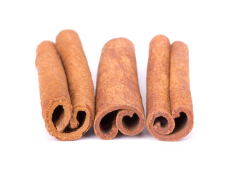 Cinnamon Sticks Stacked isolated on White background closeup macro shot