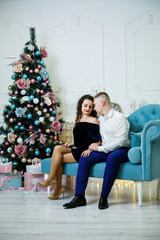 Obraz premium couple of lovers in the New Year decorations