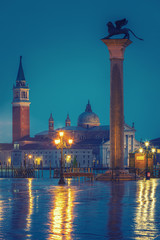 Piazza San Marco at night, view on venetian lion and san giorgio maggiore, Vinice, Italy