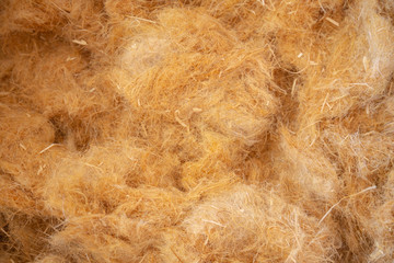 Closeup of hemp wool, an ecological insulation material which is environmentally friendly and completely recyclable