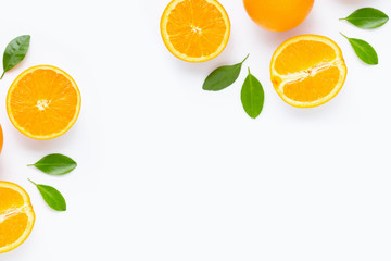 Fresh orange citrus fruit with leaves isolated on white background.