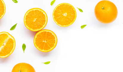 Fresh orange citrus fruit with leaves isolated on white background.