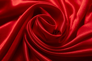 Obraz premium Luxury red satin smooth fabric background for celebration, ceremony, event invitation card or advertising poster