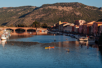 BOSA, ITALY / OCTOBER 2019: Life in the colorful fishermen's village in the north iof Sardinia