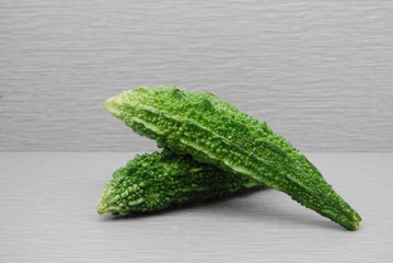 Whole Bitter Melon on a gray background
