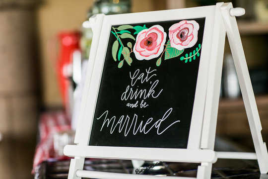 Eat drink and be married sign at wedding