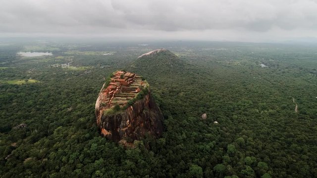Aerial of LION ROCK SIGIRIYA , Sri Lanka  Central Province.Tourists visiting famous Lion Rock fortress with ancient gardens.