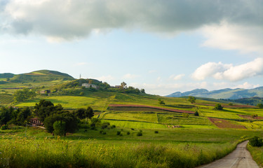 Landscape with colorful blossoming pastures and fields, honey flowers sulla from Sicily, agriculture in Italy