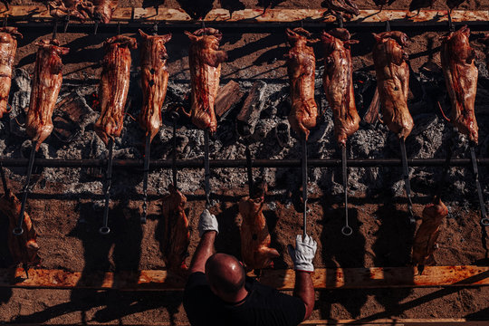 ORGOSOLO, SARDINIA /OCTOBER 2019: The old tradition of cooking the Porceddu Sardo, a young pig.