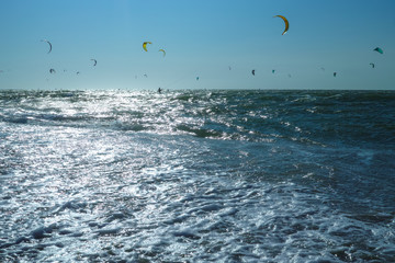 Water sport event, kite surfers race in North Sea near Renesse, Zeeland, Netherlands