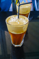 Traditional greek cold coffee Frappe made from water, instant coffee and ice cubes