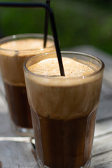 Traditional greek cold coffee Frappe made from water, instant coffee and ice cubes
