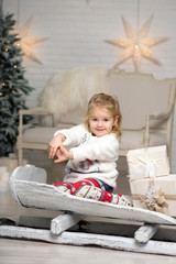 Christmas is already here. Girl sledding with christmas gift box. Small cute girl received holiday gifts. Kid hold gift box while sledding. Celebrate christmas. Winter activity.