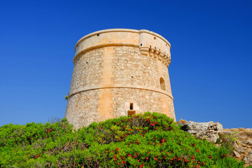 Fototapeta na wymiar View on the Defense Tower Alcaufar on Menorca.