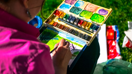 Artists paint in the summer Park