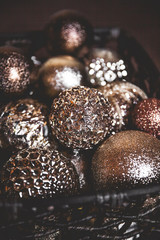 vintage christmas, new Year toys and decoration in basket on brown wooden table, copy space