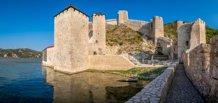 Summer afternoon view of restored medieval Golubac fortress, trdava Golubac  on the bank of the Danube in Serbia for Yugoslavia across from Romania major tourist destination