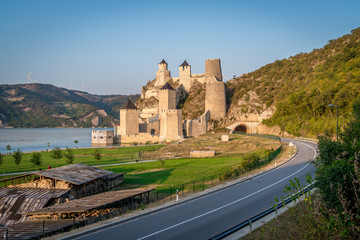 Fototapeta na wymiar Summer afternoon view of restored medieval Golubac fortress, trdava Golubac on the bank of the Danube in Serbia for Yugoslavia across from Romania major tourist destination