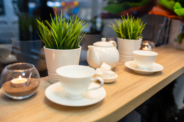 Cup of fresh boiled coffee in cafe with christmas decoration