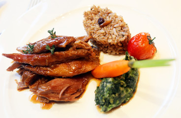 Lamp meat with vegetables and rice on the dinner plate