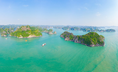 Aerial view Lan Ha Bay Cat Ba island Ha Long Bay, unique limestone rock islands and karst formation peaks in the sea, famous tourism destination in Vietnam. Scenic blue sky.