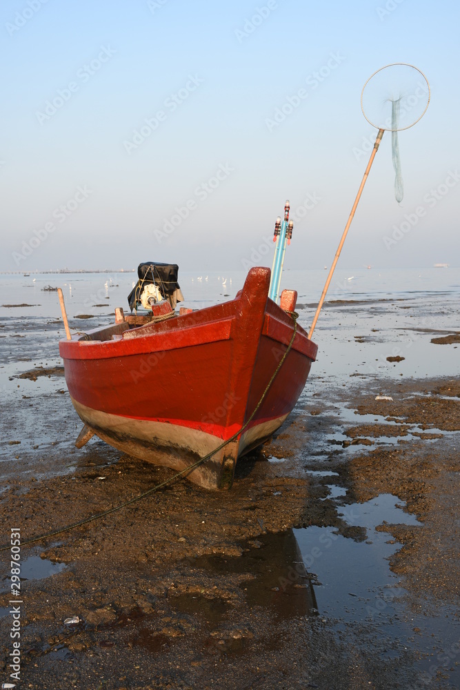 Wall mural fishing boat on the beach