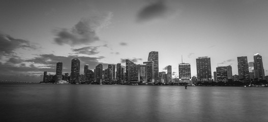 black and white city views sea water buildings