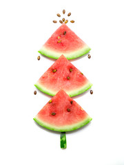 Watermelon slices in shape of Christmas tree isolated on white