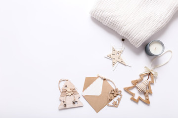 Christmas cozy background with wooden tree toys,  warm sweater and old letter. Flat lay for bloggers