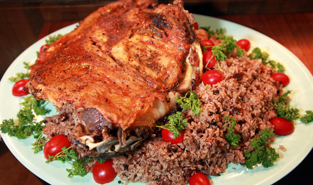 Rib roast with rice on the dinner plate