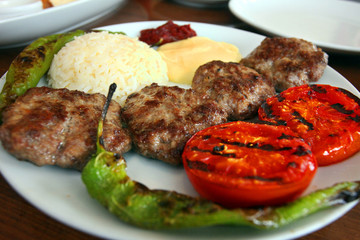Meatballs with rice and vegetables on the dinner plate