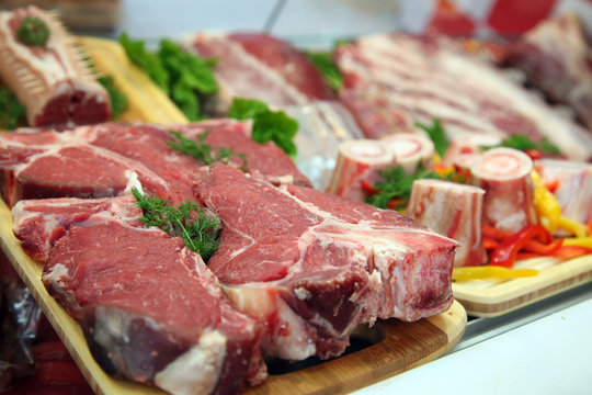 Raw meat on the butcher table