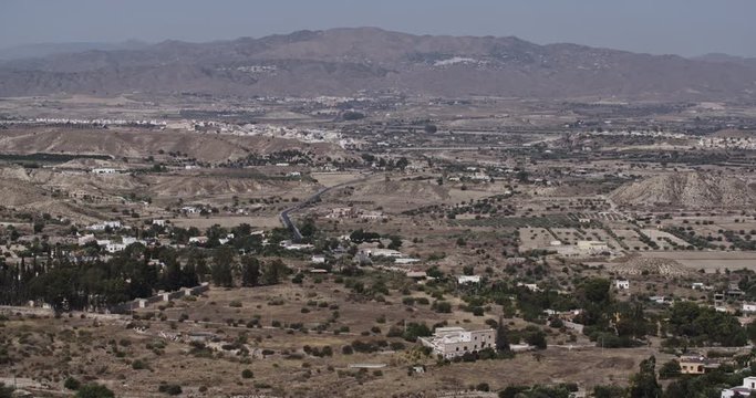 Establishing long shot of a valley near the town of Mojacar in Andalusia, Spain by summer.