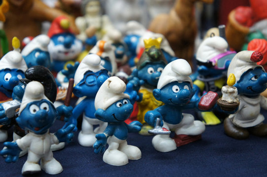 KUALA LUMPUR, MALAYSIA -DECEMBER 9, 2018:  Selective focused of fictional cartoon action figure Smurfs in miniature model displayed for the public on a desk. 