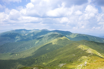 Obraz premium Mountain Range with Silhouettes through the Fog