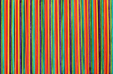 Obraz premium Colorful wooden wall texture background in bright rainbow colors pattern.