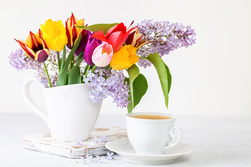 Bouquet of tulips and a lilac and coffee