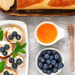  breakfast set with ricotta, blueberries and honey sandwiches
