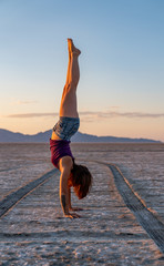 Beautiful Woman Doing Handstands In The Bonneville Salt Flats