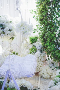 Beautiful Decoration Baby Cradle With White And Green Theme. Baby Shower Ceremony Concept.