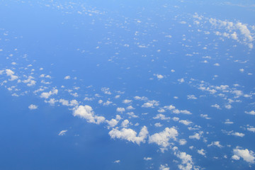 Fototapeta na wymiar Blue sky with small white fluffy cloud