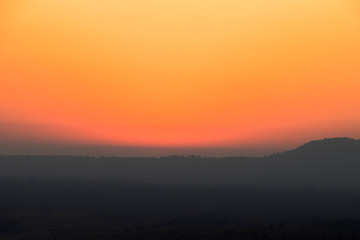 Clear glory red sky after sunset with mountain view.