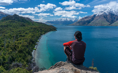 Man sitting at a lake