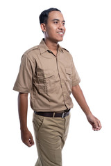 Fototapeta premium gesture of young man in uniform walking isolated over white background