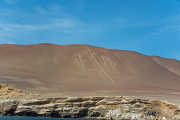 Fototapeta na wymiar The Paracas Candelabra, also called the Candelabra of the Andes, on the Ballestas Islands (Peru)