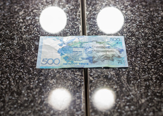 five hundred tenge on a black table